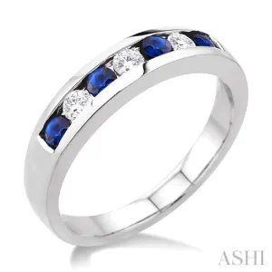 1/5 Ctw Channel Set Round Cut Diamond and 2.5 MM Round Cut Sapphire Band in 14K White Gold